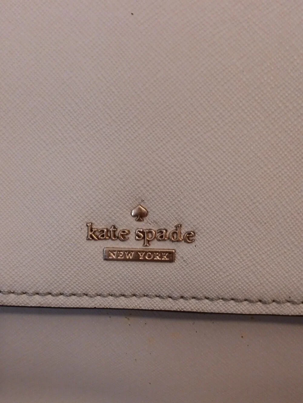 kate spade cream saddle crossbody with gold-tone logo